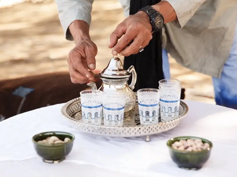 Tour Guide Preparing Afternoon Tea at Nubia Desert Camp, Morocco